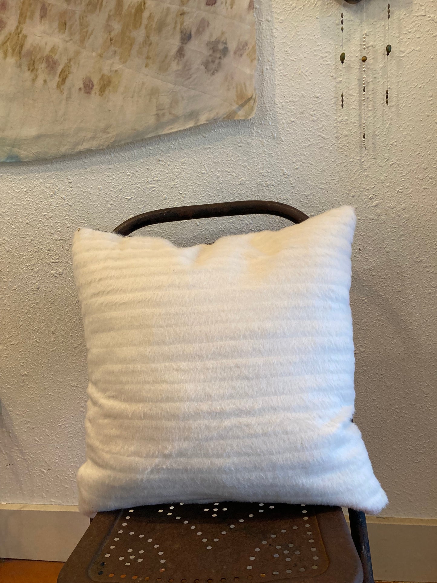 Pillows - white faux fur and woven Indonesian fabric